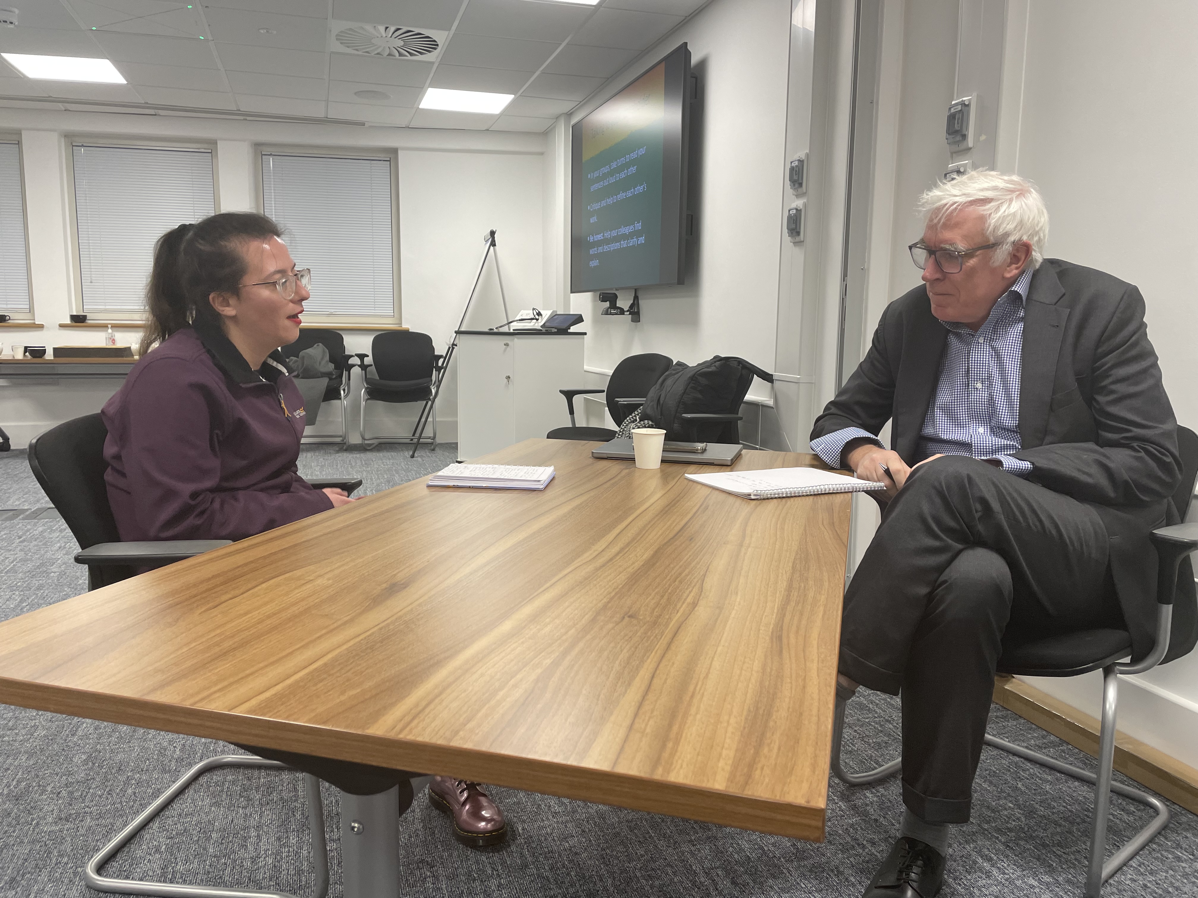 Megan Smith-Dobric delivering her pitch to the "Minister" (played by Owen Bennett-Jones)